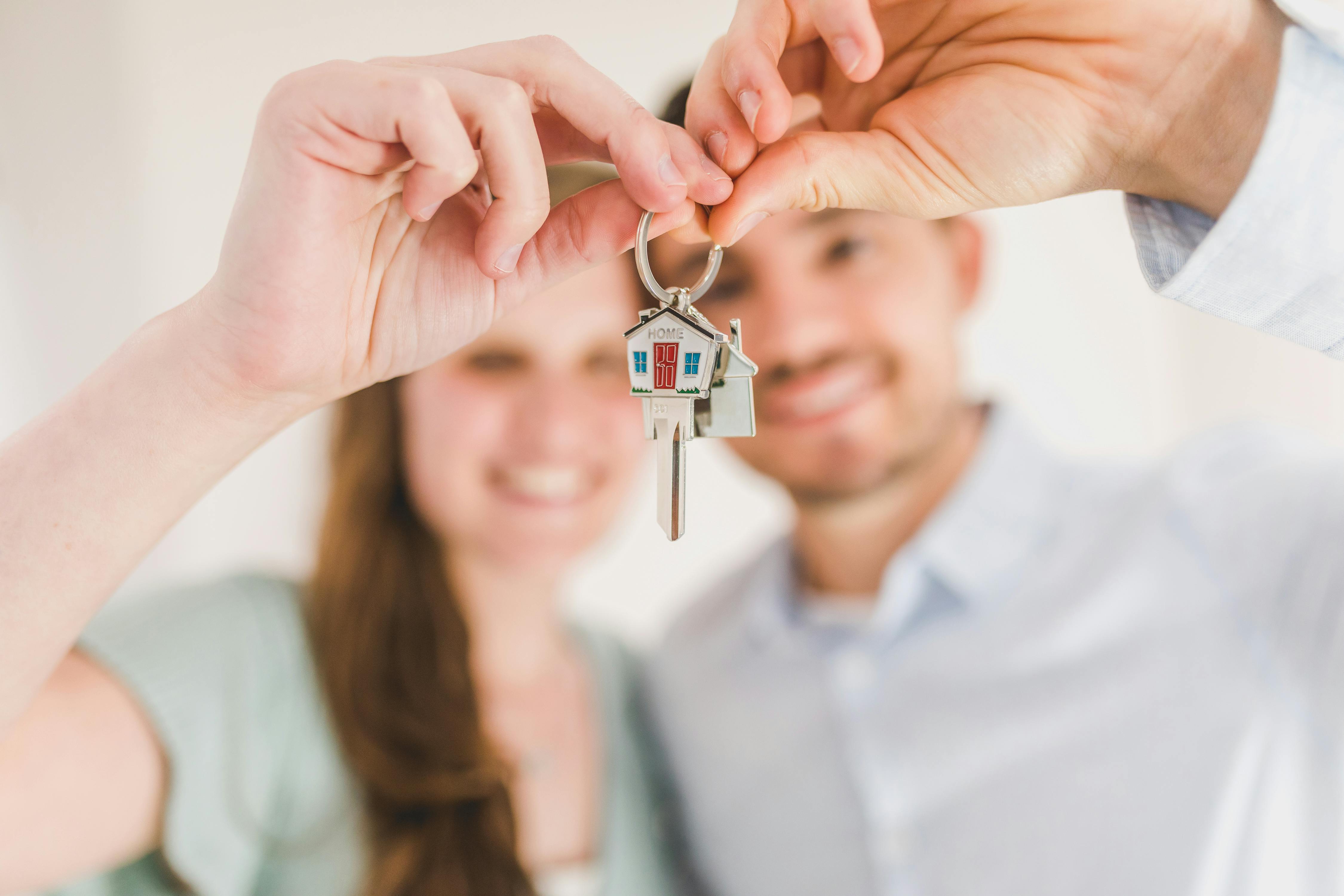 Couple holding keys to their new home
